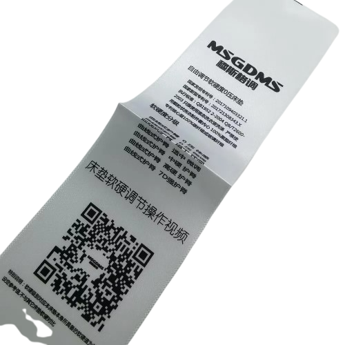 Smooth and durable satin label featuring custom artwork and logo design UAE for professional garment branding.