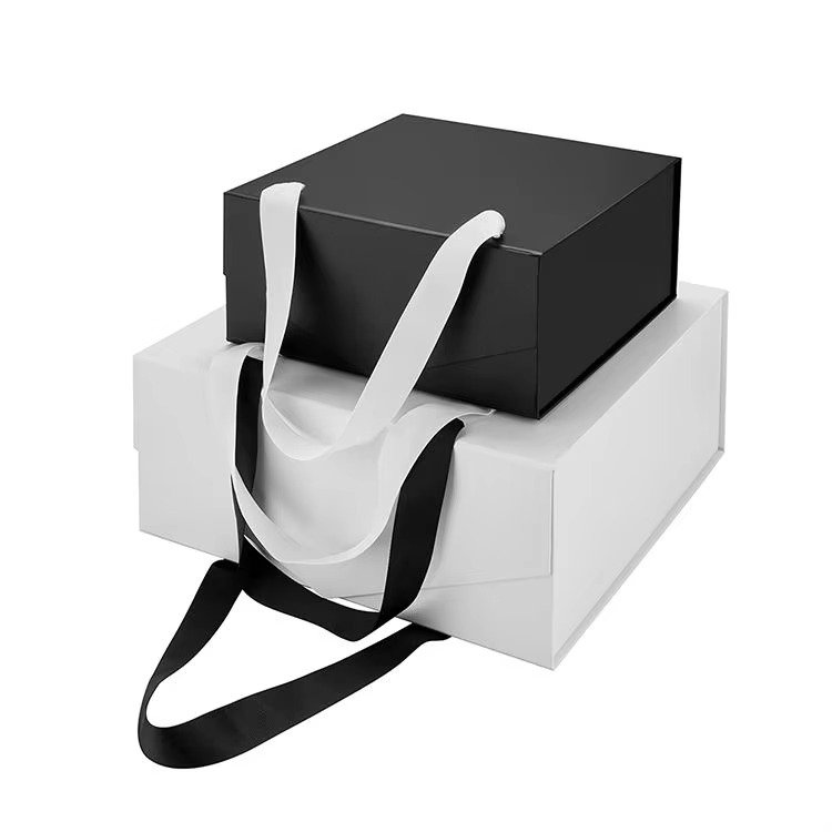 High-quality DIY gift box with contrasting black and white tones, ribbon branding, and handle for easy carrying.