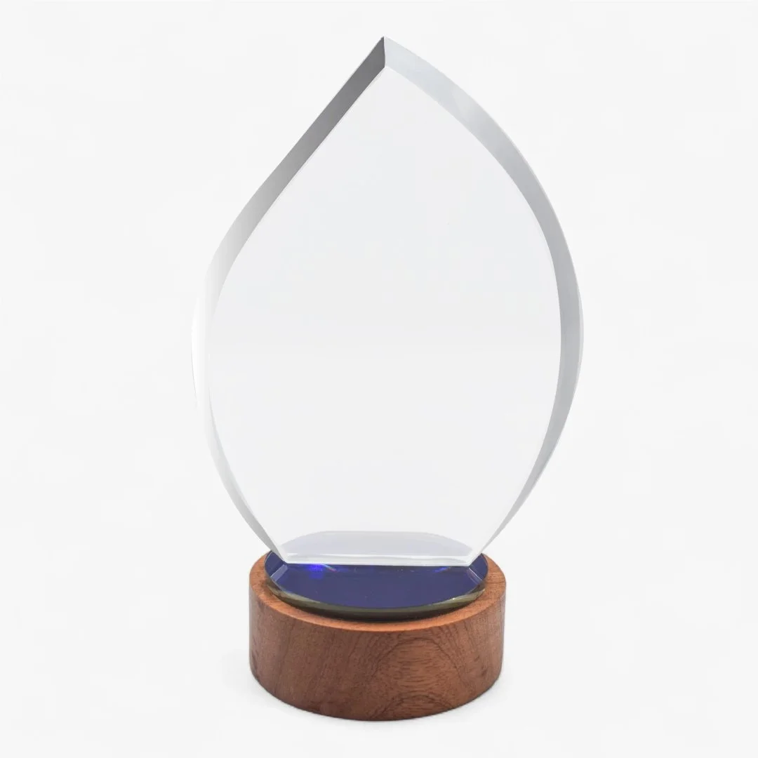 Elegant flame crystal trophy with wooden base designed for corporate awards recognition events and premium appreciation gifting UAE.