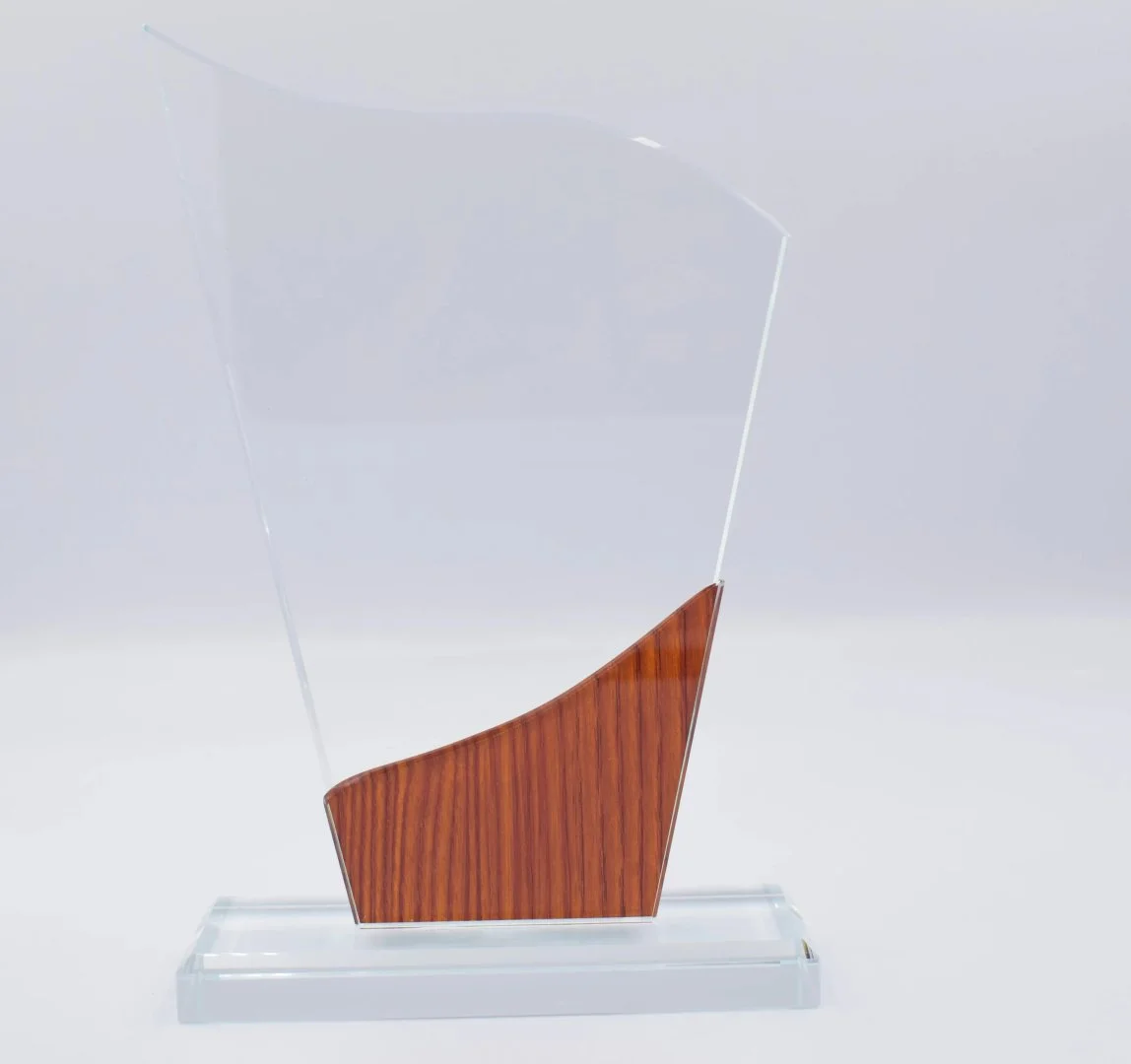 Crystal wave award with wood accent base designed for corporate awards recognition events employee appreciation and premium gifting UAE.